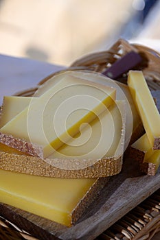 French cheese Comte, three varieties 1 year matured Prestige, fruity flavoured Fruite and Vieille Reserve close up