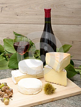 French cheese with a glass and a bottle of wine