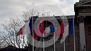 French and Chinese flags in the wind in front of National Assembly