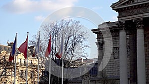 French and Chinese flags in the wind in front of National Assembly
