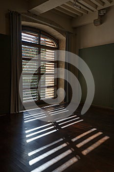 French classical architecture interior with wooden windows and shadows