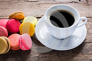 French colorful macarons with cup