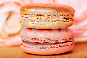 french cookies macaron on golden backgrouns