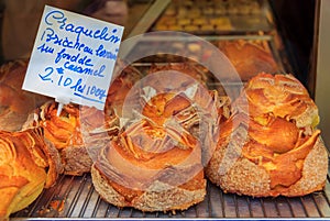 French Craquelin sugary brioche with a crispy top and caramel filling at a bakery in Cannes France photo