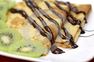 French crepes with chocolate and kiwi