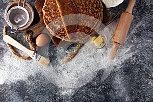 French crepes or pancakes with ingredient on grey background.