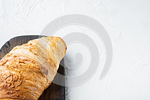 French croissant, on white stone  background, top view flat lay, with copy space for text