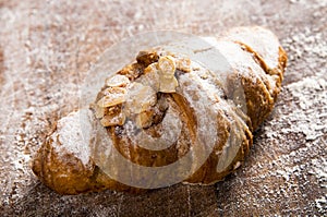 French croissant on wood background