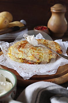 French cuisine. Pomme darphin: roasted pancakes from raw grated potatoes