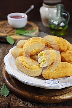French cuisine. Pomme dauphine: deep-frying crisp potato puffs from mashed potatoes. Potato cutlet. Rustic style photo