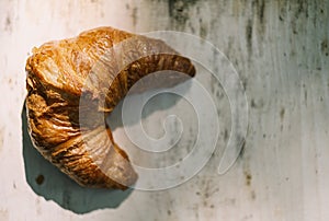 French delicious breakfast . Croissants on wooden background