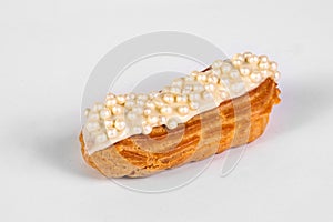French dessert Eclair with white glaze