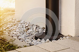 French Drain Stone Pebble and Waterspout