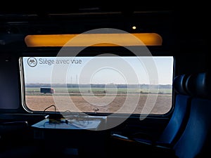 French fast train with text on the window Siege avec vie translated as Seat with