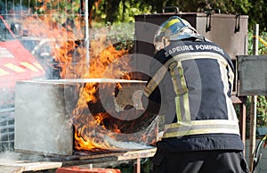 french fireman showing how to extinguish a fire