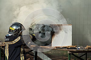 french fireman showing how to extinguish a fire