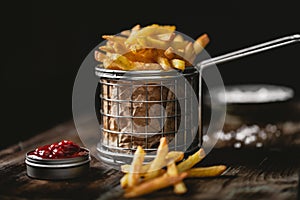 French fries in a basket with ketchup