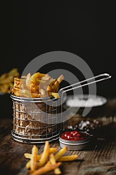 French fries in a basket with ketchup