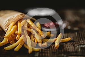 French fries in a basket with ketchup