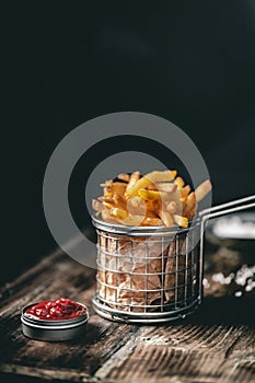 French fries in a basket with ketchup