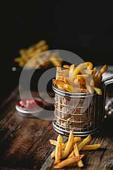 French fries in a basket with ketchup