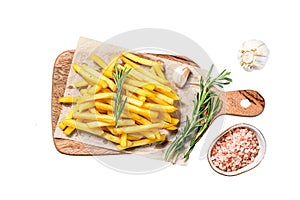 French fries on a cutting board, fried potatoes. Isolated on white background. Top view.