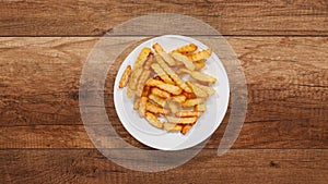 French fries disappear from a slowly rotating plate