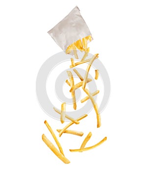 French fries fly out from paper packaging, isolated on a white background