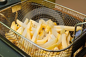 French fries fried in oil golden patato. photo