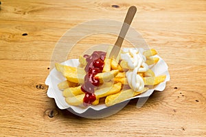 French fries with mayonnaise and ketchup