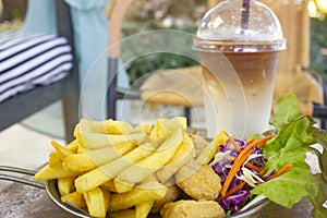 French fries and Nuggets meal on wood table,  junk food and unhealthy food