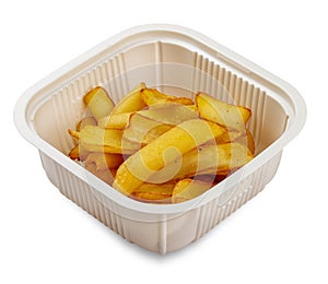 French fries. In a plastic container. Food to go. On a light background