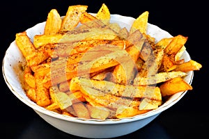 French fries popular food and snack - is a piece of potatoes, fried in a large amount of strongly heated vegetable oil or animal