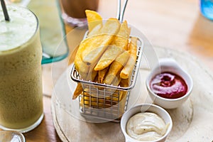 French Fries with Sauce and Smoothies Yogurt.