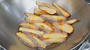 French fries is scorch cooking in hot pan