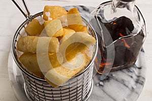 French fries in a serving basket, served with malt vinegar