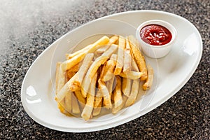 French fries with a side of ketchup