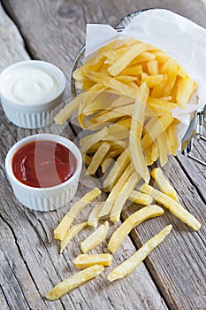 French fries with tomato ketchup and mayonnaise