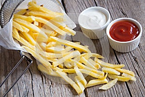 French fries with tomato ketchup and mayonnaise