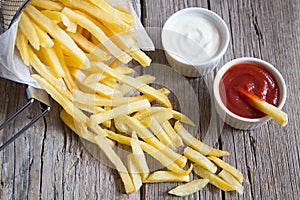 French fries with tomato ketchup and mayonnaise