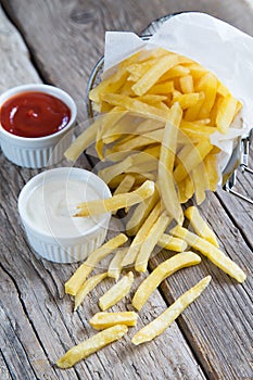 French fries with tomato ketchup and mayonnaise