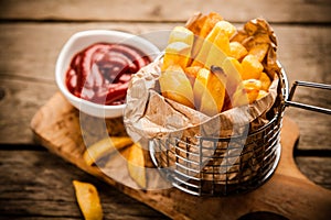 French fries on wooden table