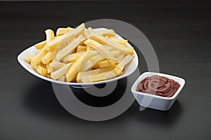 French fries on wooden Table with catchup