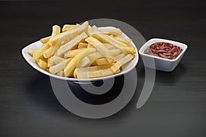 French fries on wooden Table with catchup