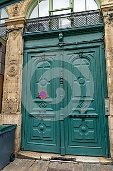 French front door in blue green color solid old wood