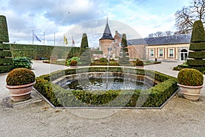 French garden with a fountain in Alden Biesen castle