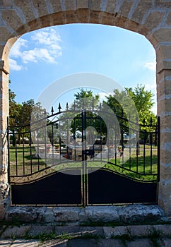 French garden with wrought iron gate