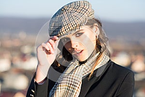 French girl with curly hair in autumn beret. retro fashion woman with makeup, parisian. Beauty and fashion look