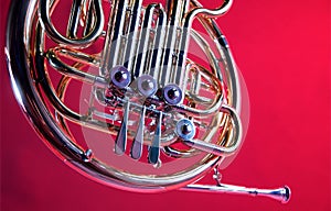 French Horn Isolated On Red