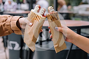 French hot dogs in woman`s hand photo